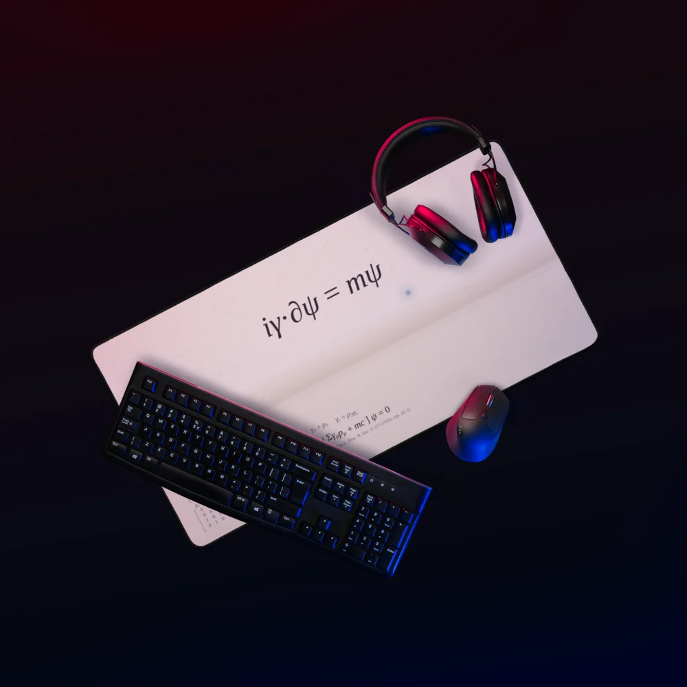 The cream desk mat seen from above under red and blue light, with a black keyboard, a mouse and headphones on it.