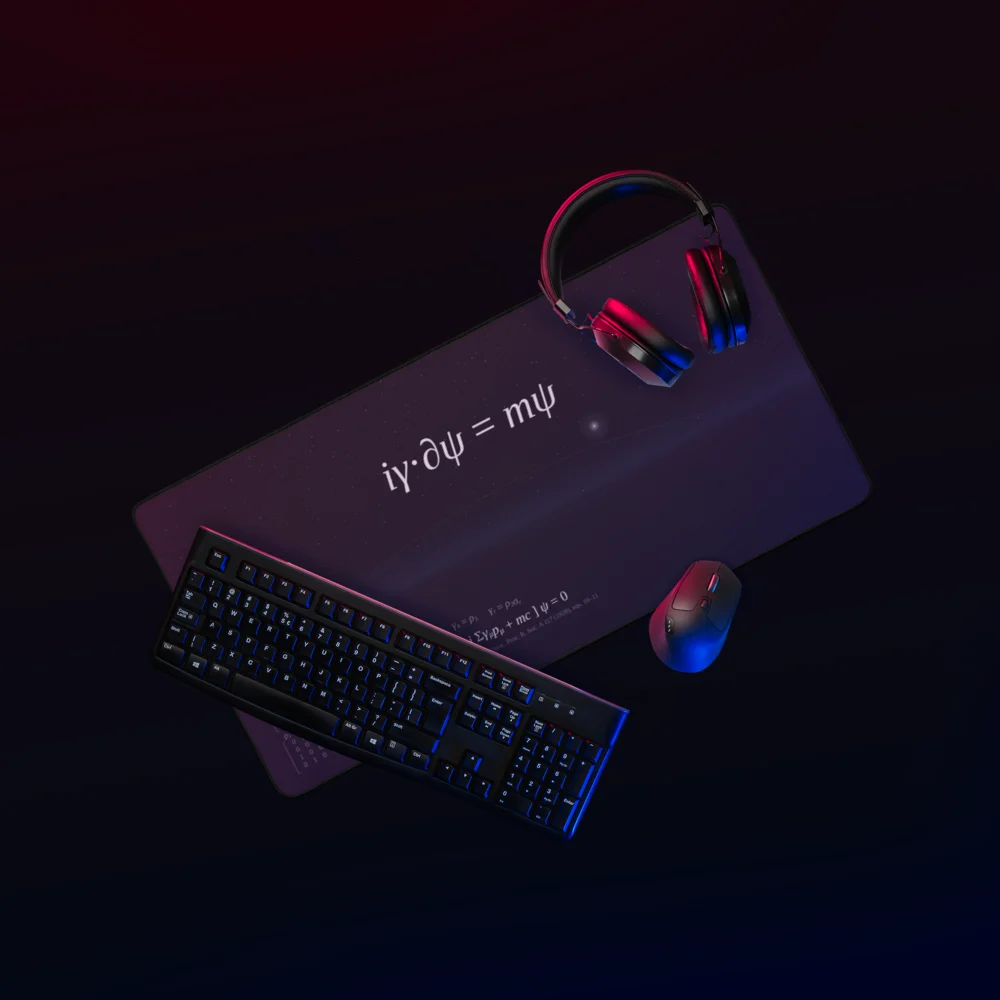 The desk mat seen from above under red and blue light, with a black keyboard, a mouse and headphones on it.